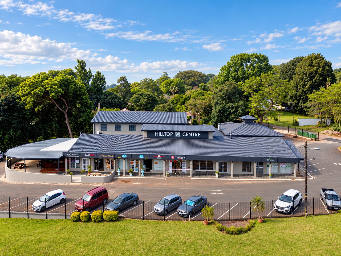 Hilltop Centre, a retail centre of shopfronts and parking seen from above
